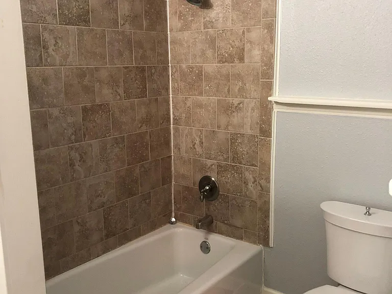 Large full bath from main level bedroom # 2 (2 of 2 pics).