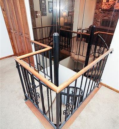 Beautiful iron spiral staircase leading to lower level (bedroom).