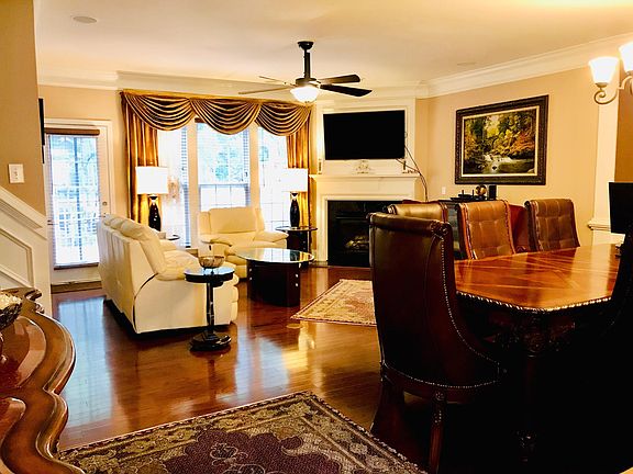 Open floor plan with gleaming hardwoods floor- Living room and dining room