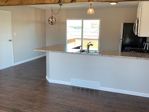 Open concept living/kitchen. Lots of natural light from front picture window and sliding doors.