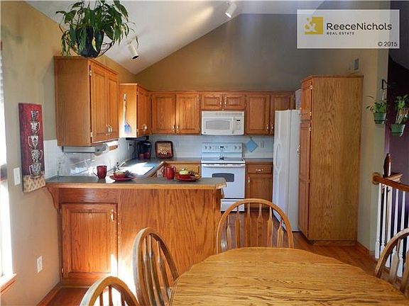 Lots of counter space and cabinets in this kitchen with large sundrenched eating area.