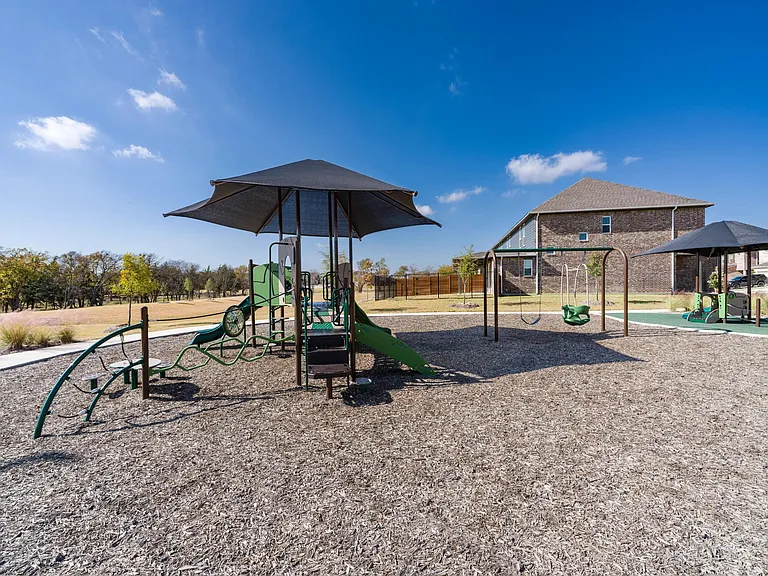 Our on-site playground features colorful play structures, a favorite spot for outdoor fun and gatherings.