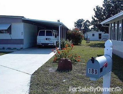 WEST SIDE OF HOME SHOWING LARGE LOT