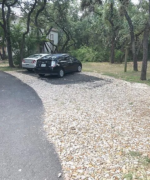 Parking area for main home includes up to three car spots.