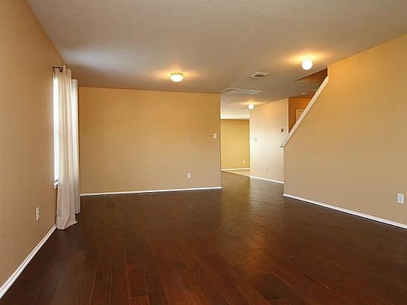 THE BEAUTIFUL HARDWOOD FLOORS EXTEND FROM THE FORMAL LIVING & DINING, INTO THE GREAT ROOM, UP THE STAIRS TO A LANDING AT THE GAME ROOM AND INTO THE MASTER SUITE ON THE 2ND FLOOR.  THIS OPEN FORMAL AREA CAN BE ARRANGED ANY WAY YOU LIKE.