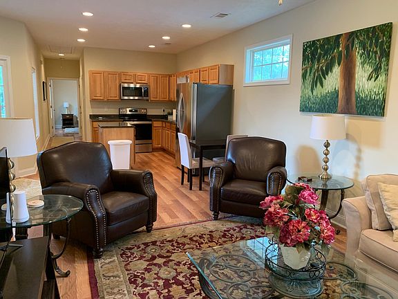 Open living room, eating area and kitchen.