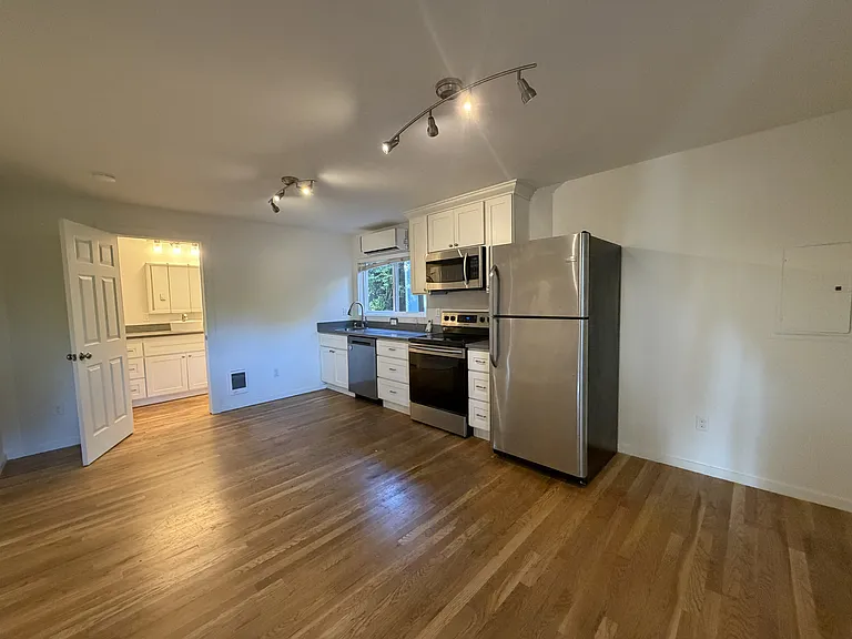 Another view of kitchen and dining space