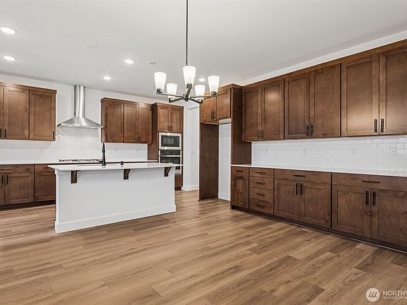 5th image of 10679 Treasure Drive NW #114