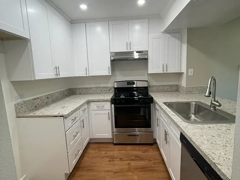 Granite counter tops and New Stainless Steel Appliances.
