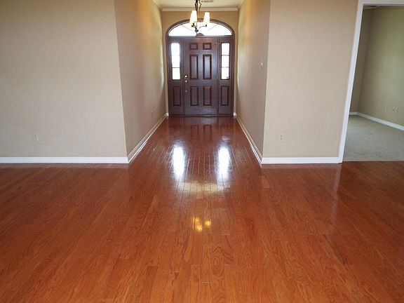 Beautiful entry leads to open living room area with hardwood floors. Bonus room located to the right could be used for office, craft room, or media room.