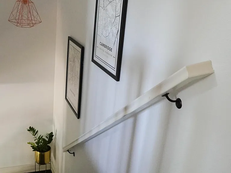 2nd floor staircase with modern copper chandelier