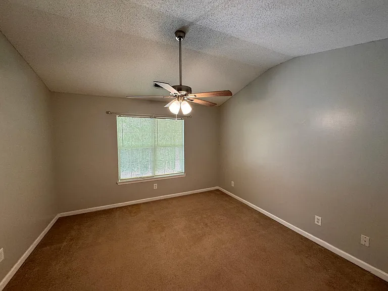 Spacious Master Bedroom w/ carpet