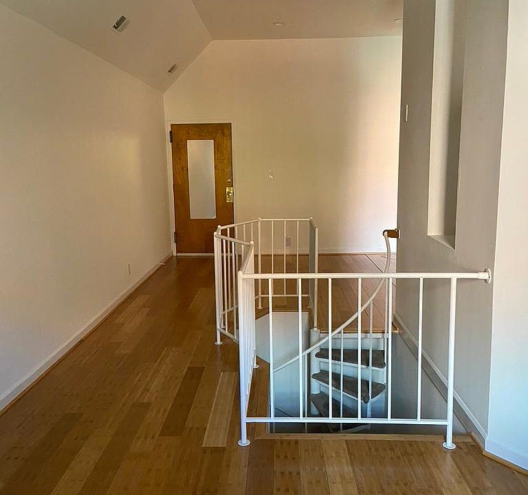 View toward front door and living room area from kitchen