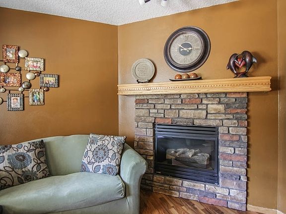 Gas Fireplace with Stone Surround and Mantle