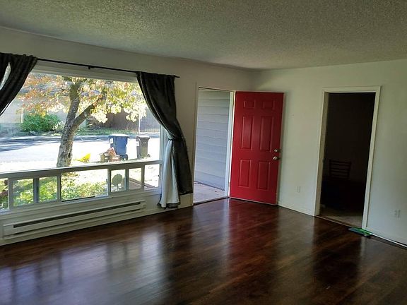 Large front room, beautiful window facing dogwood tree in large front yard