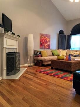 Great room with hardwoods, soaring ceiling, fireplace