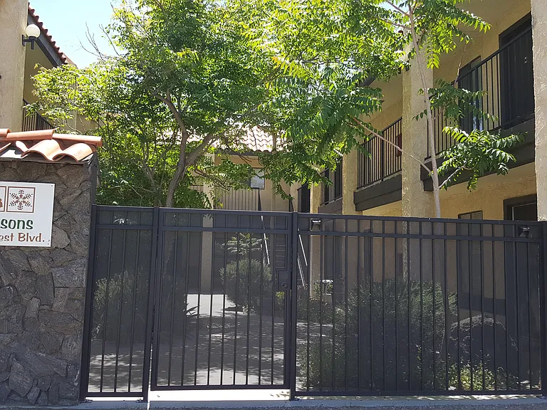 Building exterior with fenced courtyard