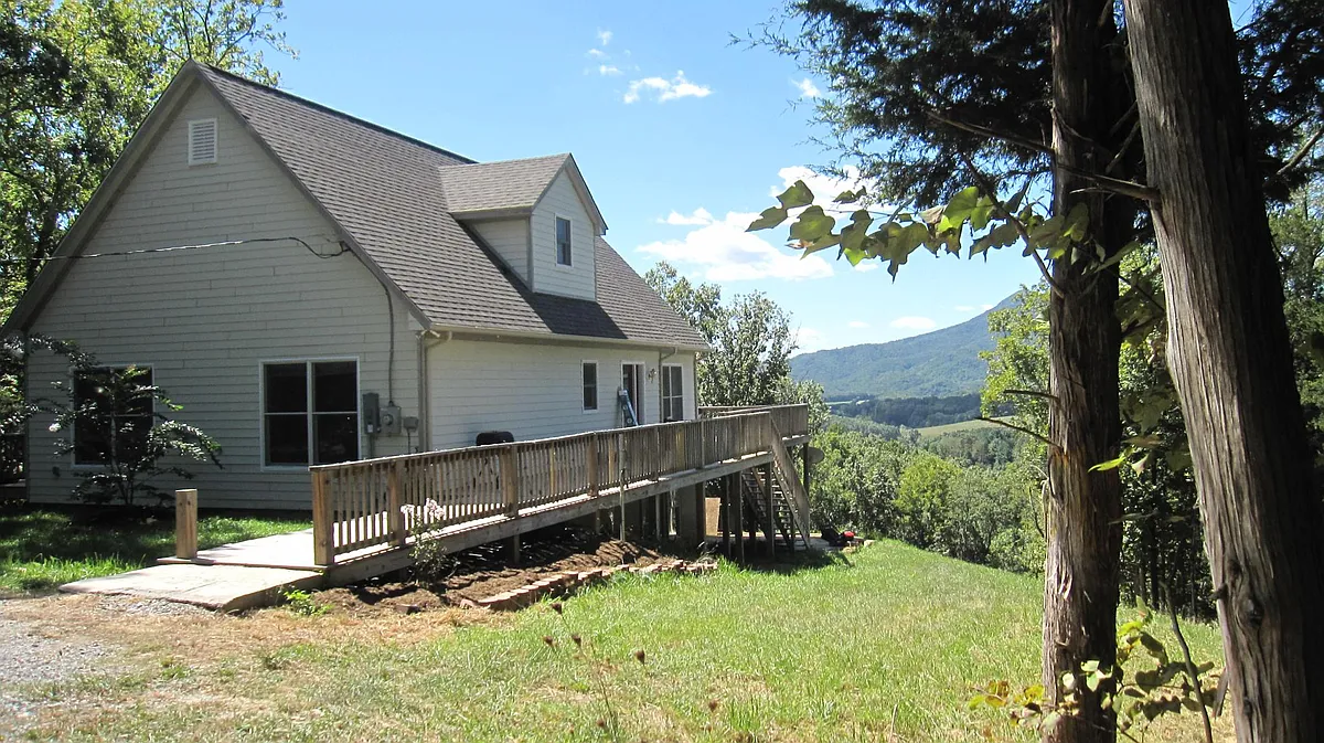 The exterior of the house showing the deck, which makes it wheelchair accessible. - 85 Otway Trl
