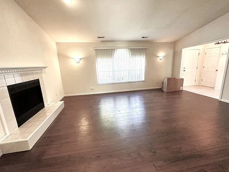 Vaulted Living Room showing decorative fireplace (for candle-burning only)