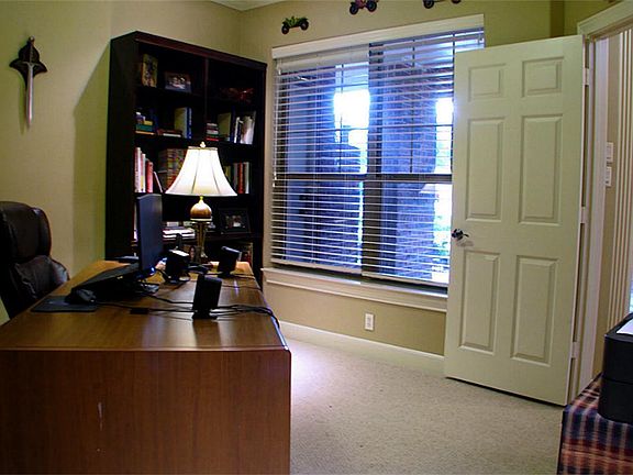 Downstairs office off the entry. Located at the front of the home, this study offers great privacy,