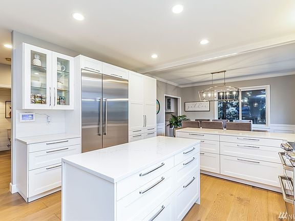 Custom kitchen remodel in 2019 down to the studs with new cabinets, hardware, flooring, appliances and more. Note the 48" built-in Fisher Paykel fridge.