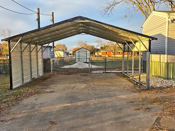 2-car carport will fit large vehicles