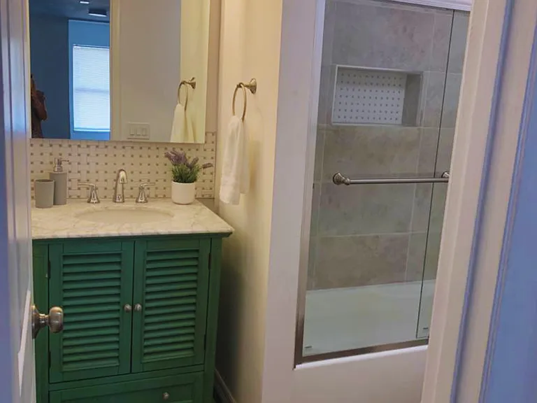 Modern Bathroom with Stylish Vanity & Spotless Shower.