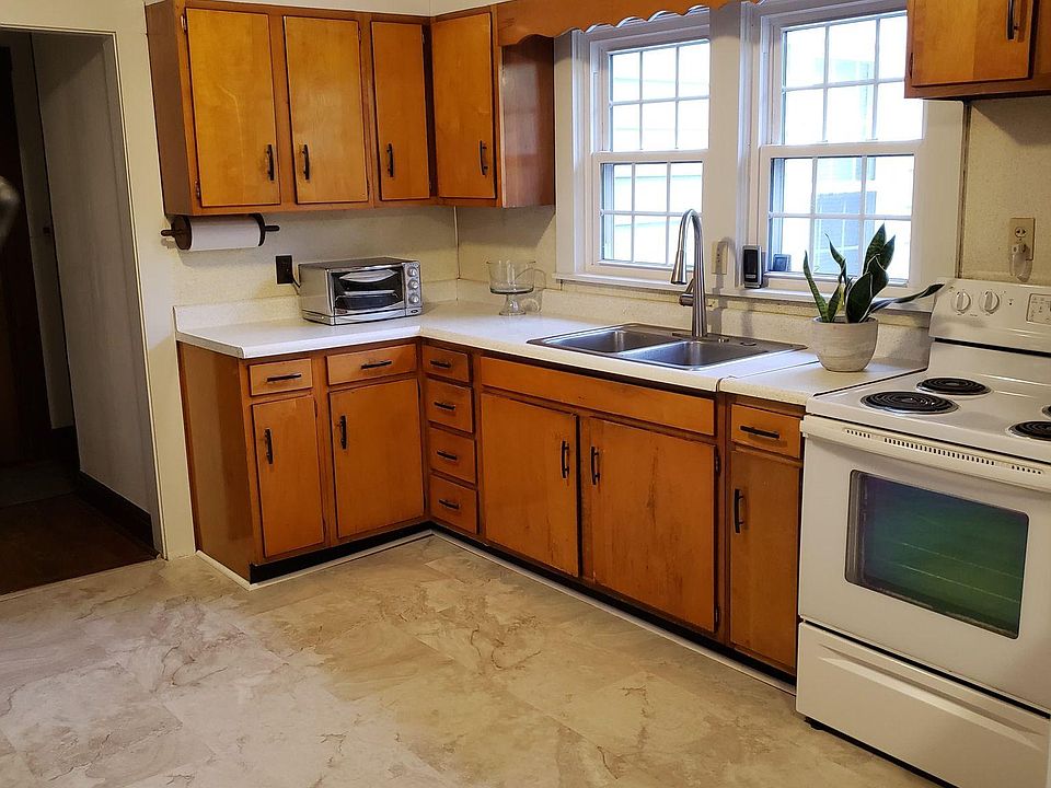 Kitchen with new floors and fresh paint.