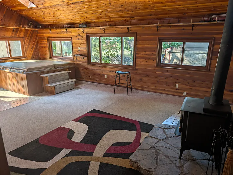 Upstairs hot tub room with fire place, electric train set and loft