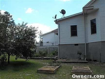 Rear of house with additional raised beds