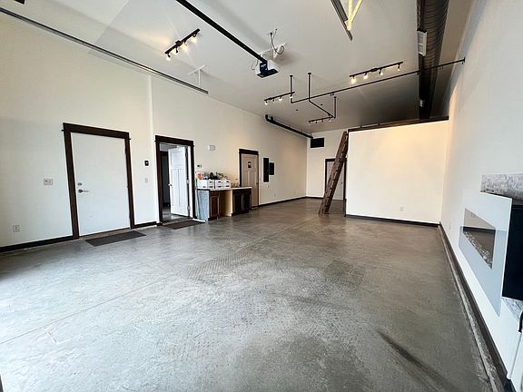 Work side showing exterior entrance into work side, access from work side into live side