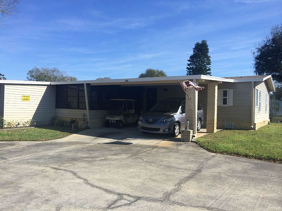 Front of Home with Carport