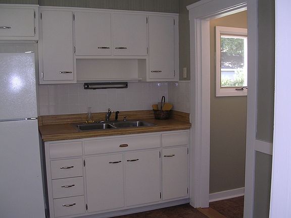 Kitchen leads to back entry & 1/2 bath