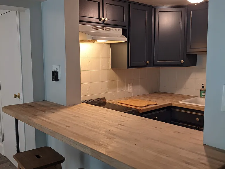 Breakfast bar looking into kitchen.