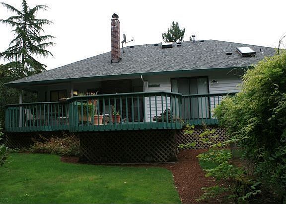 Partially-covered, cedar deck off rear family room and master bedroom.
