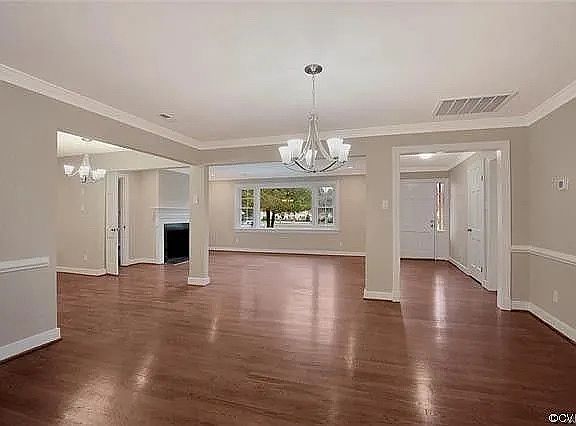 Open-concept floor plan flowing seamlessly from the front door, opening up to the formal dining, living and kitchen areas.