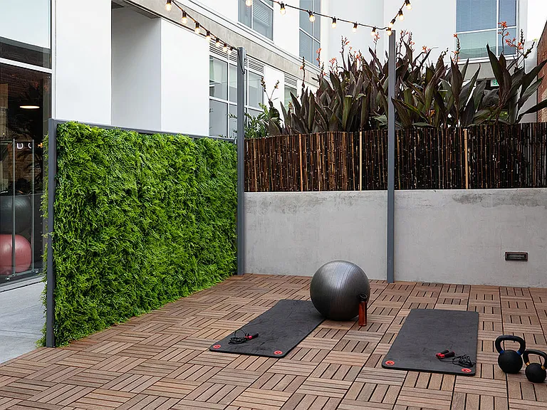 Apartment community outdoor yoga studio at Griffis East Village in San Diego, California.