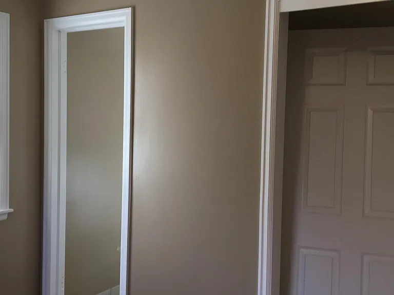Master bedroom showing closet and door to master bath