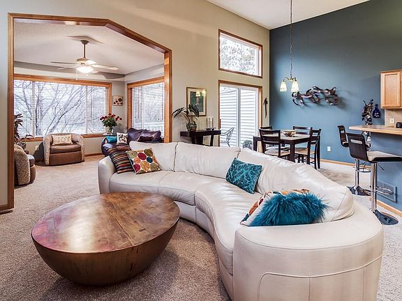 Spaces flow together perfectly in the great room. Deck outside the dining area has lovely views.