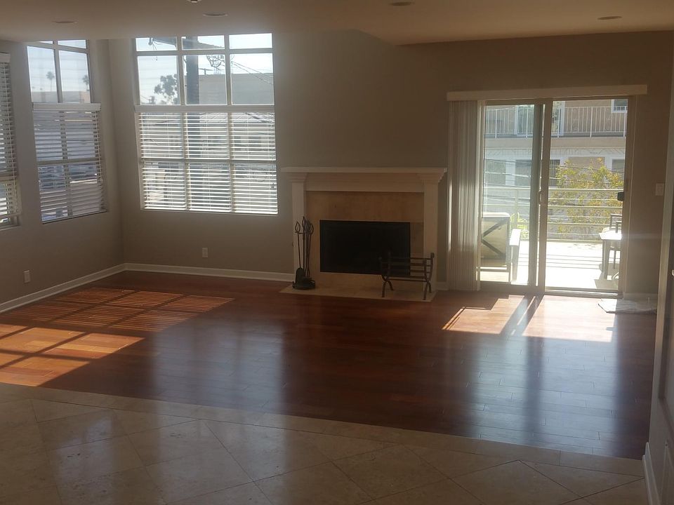 Living Room with Fireplace, Hardwood Floors and Lots of Natural Light
