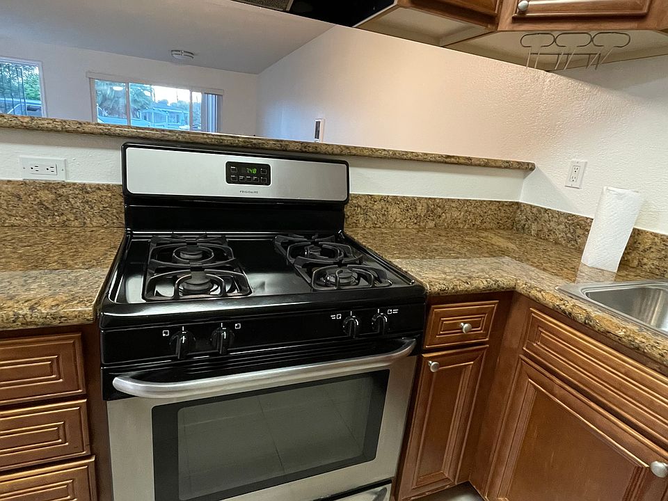 Gas oven purchased August 2024. Tile flooring in kitchen