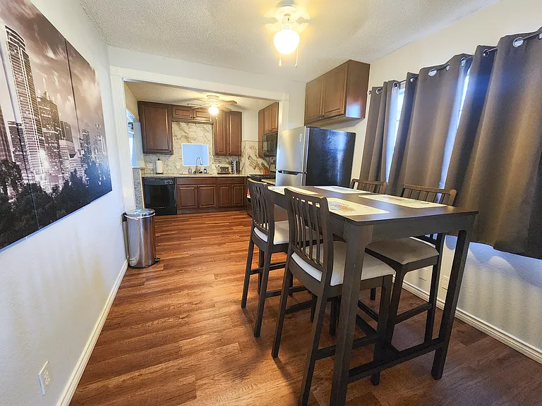 Kitchen and dining area from laundry room