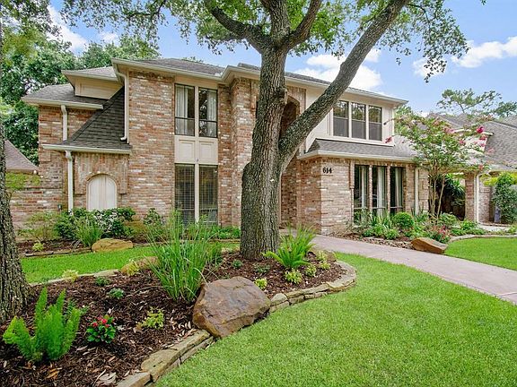 Mature trees and lovely landscaped rock flower beds!