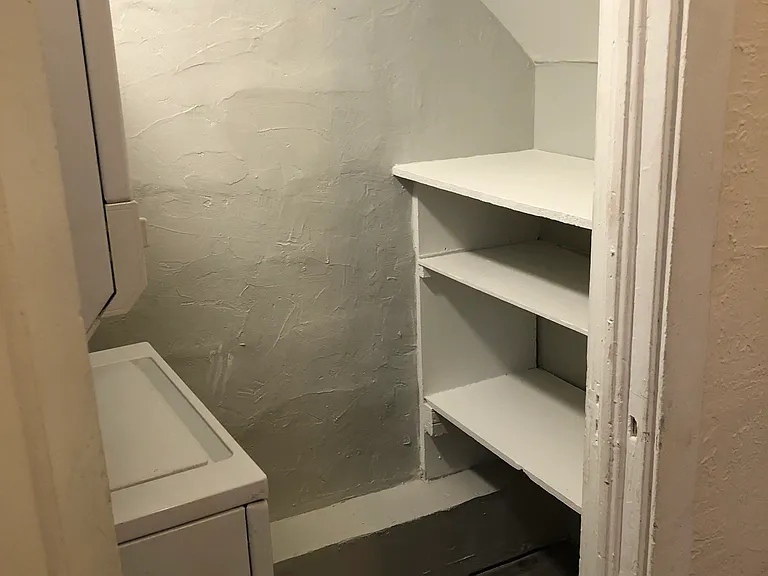 Laundry room comes with storage areas as well.