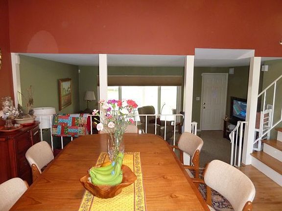 view looking out into living room and covered patio