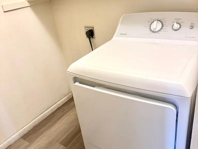 Laundry area with dryer, and washer hook-up in unit