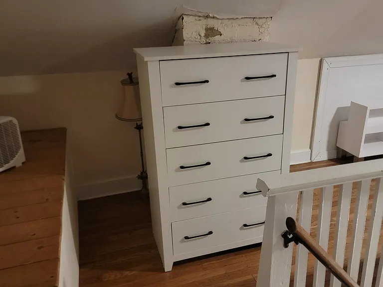 Upstairs bedroom with two single beds.