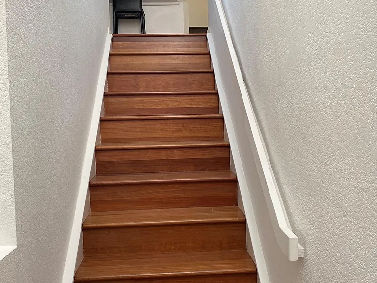 Stairs leading to the upper level residence.