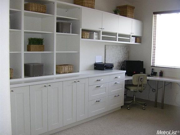 A wall of storage and built-in desk in the upstairs loft create an ideal space for a home office, craft room, play room or use your imagination. This room could also be easily converted to a 5th bedroom.
