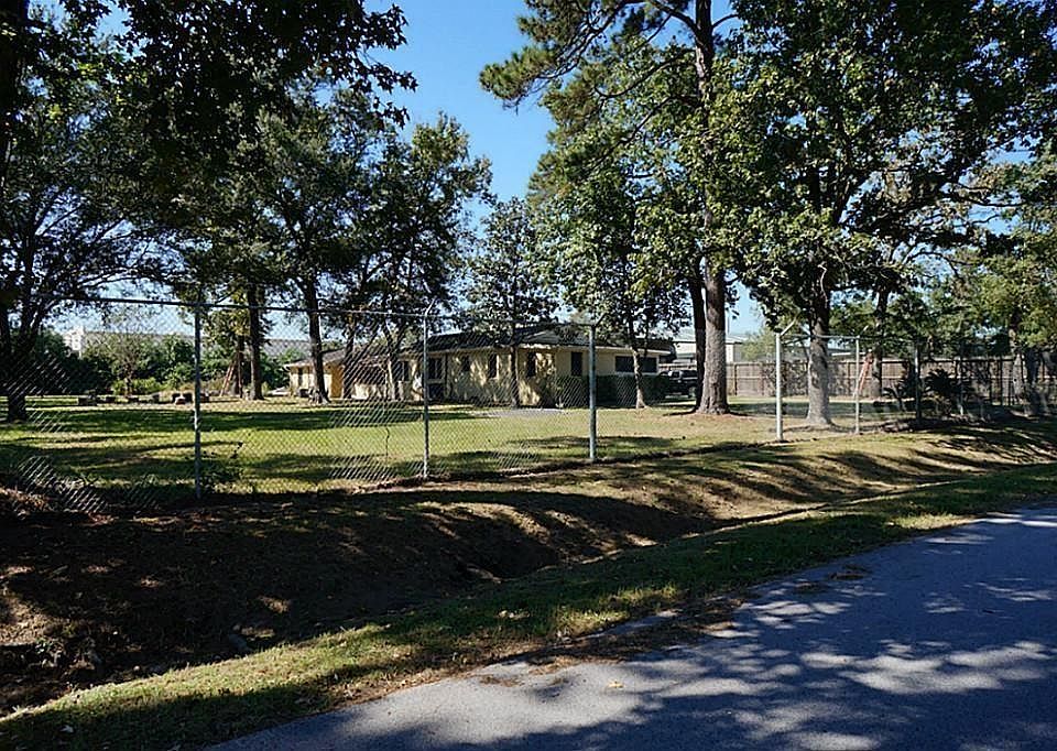 One acre lot with an existing home that could be used for office space and/or residential if desired. This property backs to Home Depot.